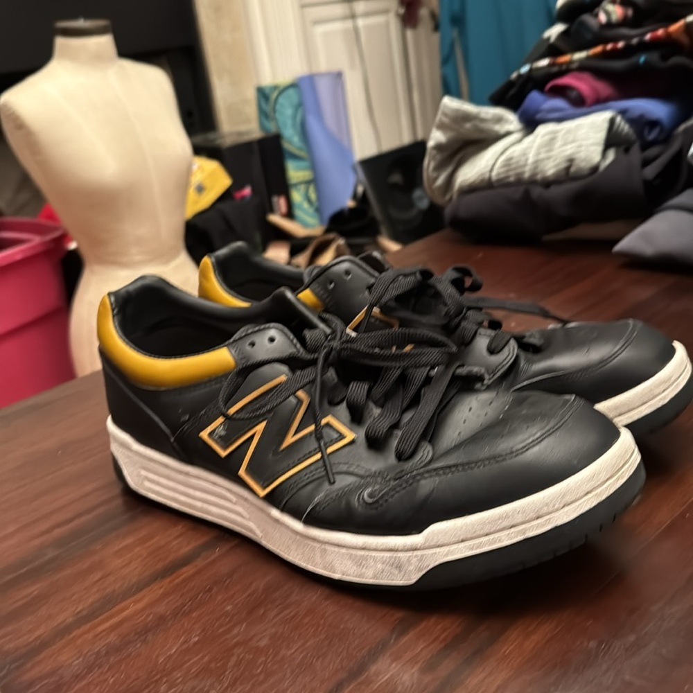 New Balance men’s black and gold/tan sneakers size 12